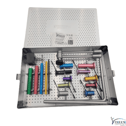 A perforated metal tray holds colored cylindrical tools, rulers, and instruments—including the Radiolucent MIS Tubular Set – Precision Minimally Invasive Spine Surgery Kit—with its lid partially open.
